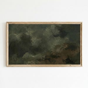 May include: A framed landscape painting with a dark, moody aesthetic. The artwork features a depiction of a cloudy sky with shades of green, brown, and gray. The painting is enclosed in a light brown wooden frame, adding a rustic touch.