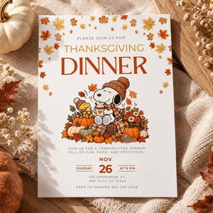 May include: A white Thanksgiving dinner invitation card featuring a cartoon dog wearing a beanie and scarf, holding a mug, surrounded by pumpkins and autumn leaves. The text reads: PLEASE JOIN US FOR THANKSGIVING DINNER, NOV 26, SUNDAY AT 5 PM.