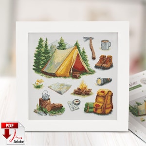 May include: Cross-stitch pattern featuring camping elements. Includes a yellow tent, trees, campfire, boots, backpack, axe, map, compass, and a mug. The design is set against a white background, evoking a sense of outdoor adventure and nature.