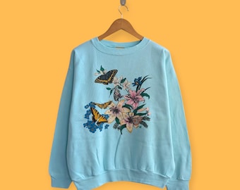 Moletom vintage de 1991 com estampa floral de borboletas e flores, em algodão, gola redonda, estilo grove, com tema de habitat animal, na linda cor azul, tamanho grande.