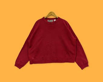 May include: A red long-sleeved sweatshirt with a crew neck and the word "Lands' End" on the tag.