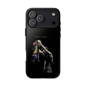 May include: Black phone case with a graphic of a footballer holding up a jersey. The jersey displays the number 10. The text "THE KING" is printed above the player.