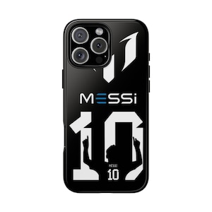May include: Black phone case with the name "MESSI" in blue and white, and the number "10" in white. The case has a glossy finish and a camera cutout.