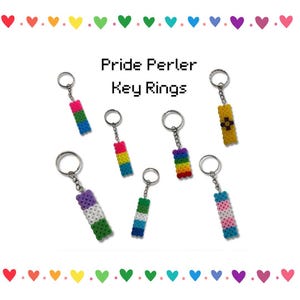 May include: Key rings with pixelated designs in various Pride flag colors. The key rings are made of colorful beads and feature different Pride flag patterns. The text "Pride Perler Key Rings" is displayed above the key rings.