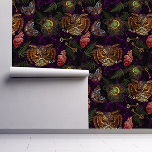 May include: A seamless pattern featuring embroidered owls, butterflies, keys, hearts, and fern leaves on a dark purple background. The design is perfect for fabric, wallpaper, or other creative projects.