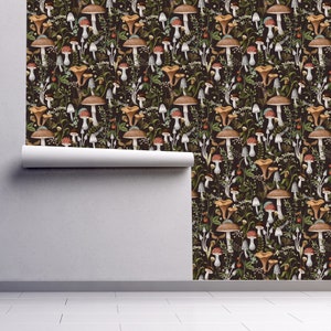 Dark botanical mushroom fabric peel and stick dollhouse wallpaper on wall partially rolled up