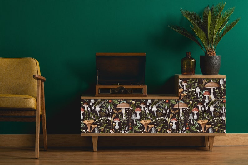 Dark botanical mushroom fabric peel and stick dollhouse wallpaper on record player cabinet with plant and chair