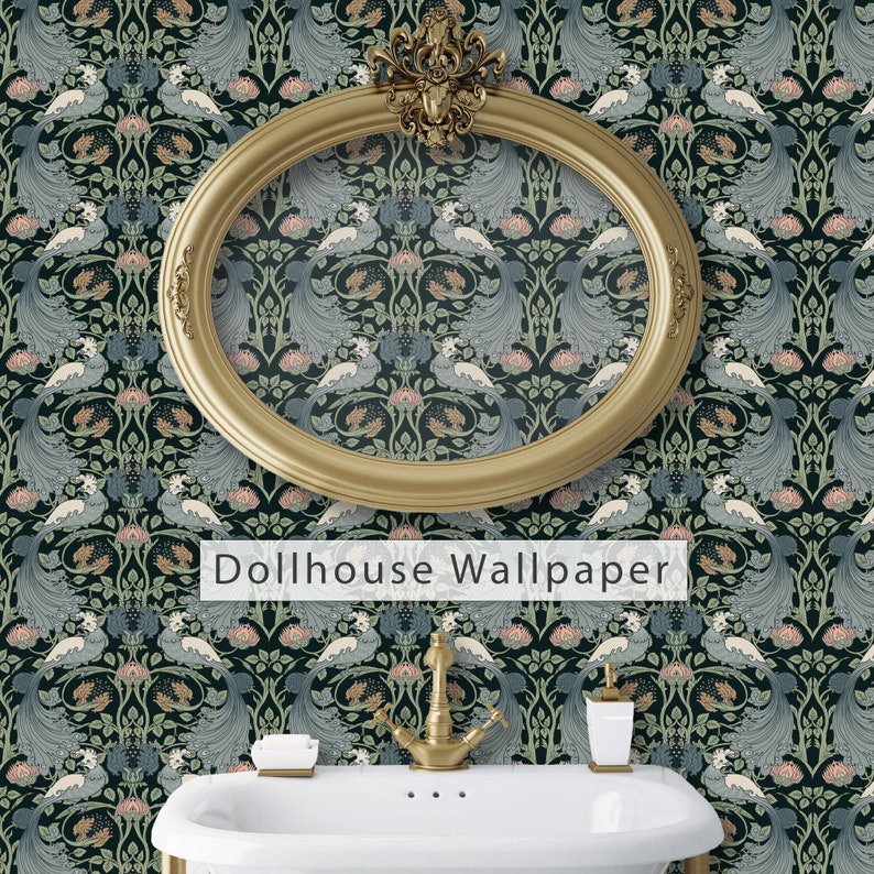 May include: A gold oval frame with a decorative design hangs on a dark blue wallpaper with a repeating pattern of peacocks and flowers. The text "Dollhouse Wallpaper" is printed below the frame. A white porcelain sink with a gold faucet is in the foreground.