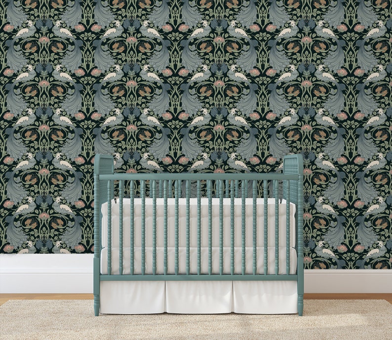 May include: A teal blue crib with white bedding in front of a black and green wallpaper with a repeating pattern of stylized peacocks and flowers.