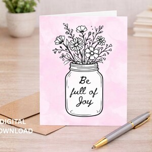 May include: A greeting card with a pink watercolor background features a black and white illustration of flowers in a mason jar. The words "Be full of Joy" are written on the jar. A pen and envelope are also in the image. The words "DIGITAL DOWNLOAD" are written on the envelope.