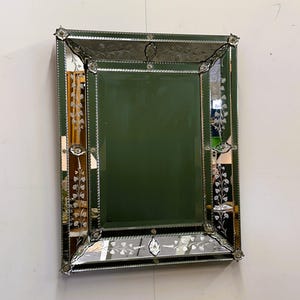 Elegant 1950s French Venetian Stule Mirror with Beveled Floral Details and Authentic Patina.