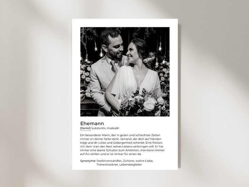 May include: Black and white print featuring a couple embracing, with text in German. The text includes the word "Ehemann" and a definition. The image is a portrait of a man and woman, likely a wedding or engagement photo.
