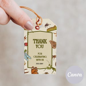 May include: A beige thank you tag with a brown string. The tag is decorated with various insects and the text "Thank You for celebrating with us xoxo, Henry".