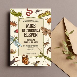 May include: A beige invitation card with a bug theme. The card features a variety of insects, including a grasshopper, a butterfly, a dragonfly, a beetle, and a worm. The text on the card reads "We are buzzing about a party Mike is turning eleven Saturday April 12 at 3 pm Fly, crawl or hop on over to 123 Any Street, Type your city, ST RSVP Anna: 333.000.1234"