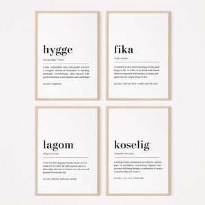 May include: Four black and white printable art prints with Scandinavian words and their definitions. The words are hygge, fika, lagom, and koselig.