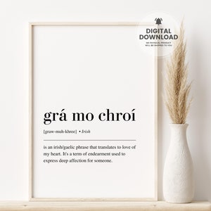 May include: A black and white printable wall art print with the Irish phrase "grá mo chroí" which translates to "love of my heart". The print also includes the pronunciation and the definition of the phrase.