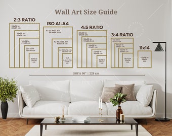 May include: A wall art size guide with different ratios and measurements in inches and centimetres. The guide shows the dimensions of various sizes of wall art, including 2:3, 4:5, 3:4, and 11x14 ratios. The guide also includes the standard ISO A1-A4 sizes. The guide is displayed on a white wall with a white sofa in front of it.