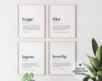 May include: Four printable wall art prints with white backgrounds and black text. The prints feature the words "hygge", "fika", "lagom", and "koselig" with their definitions.