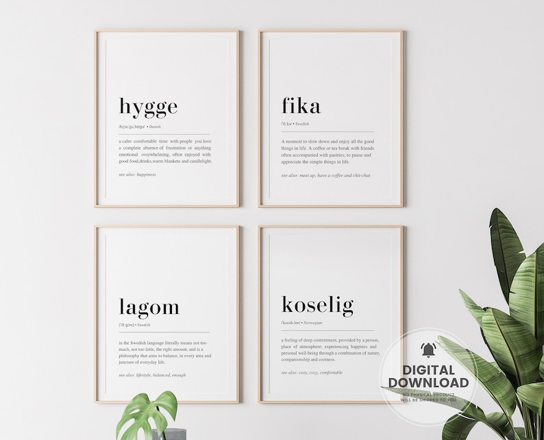 May include: Four printable wall art prints with white backgrounds and black text. The prints feature the words "hygge", "fika", "lagom", and "koselig" with their definitions.