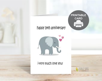 May include: A white greeting card with a cartoon elephant and the text "happy 14th anniversary" and "i-vory much love you!". The card also has three pink hearts and a "Printable Card" icon.