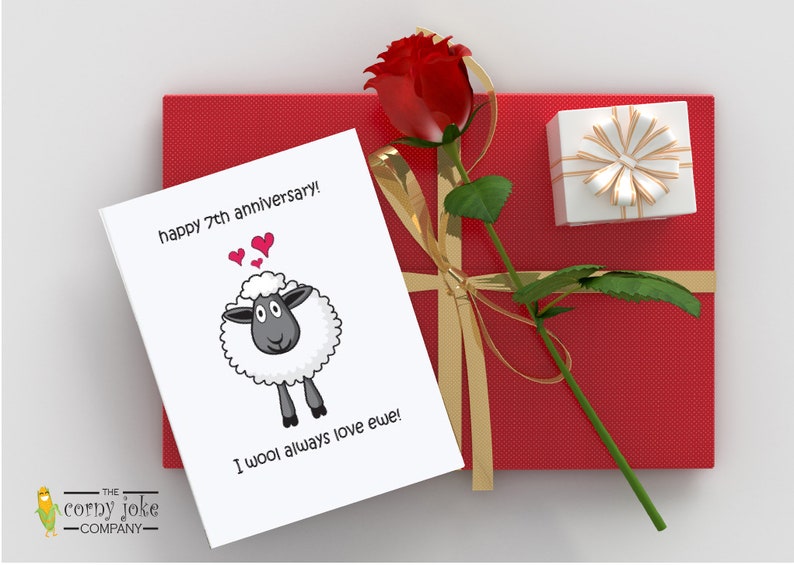 Funny 7th Wool Anniversary Card to Celebrate Seven Years Together with this fun Anniversary Card, featuring a cartoon sheep and the pun message I wool always love ewe, with red gift package, from the Corny Joke Company