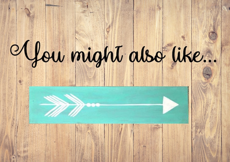 May include: A teal blue wooden sign with a white arrow pointing to the right. The sign has the text "You might also like..." written in black cursive.