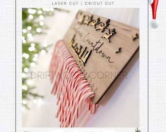 May include: A wooden sign with the text "Christmas Countdown" and a design of a Christmas tree and reindeer. The sign has 25 numbered spaces for candy canes, with 24 candy canes hanging from the sign.