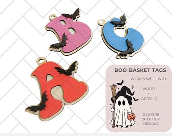 May include: Three layered wooden Halloween letter tags in the colors red, pink, and blue. Each letter has a cutout design of a bat. The letters are A, B, and C. The image also includes a ghost with a pumpkin and a broom, and the text "BOO BASKET TAGS", "WORKS WELL WITH WOOD + ACRYLIC", "3 LAYERS 26 LETTER DESIGNS", and "GLOWFORGE TESTED DIGITAL .SVG CUT FILE".