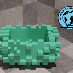 May include: A green 3D printed planter made of small cubes. The planter is empty and has a square shape.