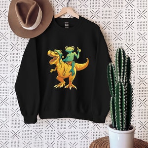 Frog Riding Dinosaur Sweatshirt, Funny T-rex Sweater, Long Sleeve Crewneck Dinosaur Sweater, T-rex Lover Gift, Cool Frog Sweater