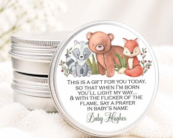 May include: A round silver metal tin with a label featuring watercolor illustrations of a raccoon, a bear, and a fox. The text reads: THIS IS A GIFT FOR YOU TODAY, SO THAT WHEN I'M BORN YOU'LL LIGHT MY WAY... & WITH THE FLICKER OF THE FLAME, SAY A PRAYER IN BABY'S NAME Baby Hughes.