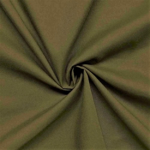 May include: A close-up of a smooth, olive green fabric. The fabric is folded and draped, showing its texture and color.