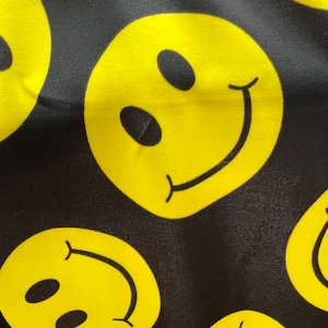 Yellow Happy Face Print on Black Four Way Stretch Nylon Spandex Fabric By The Yard, 60&#39;&#39; Wide