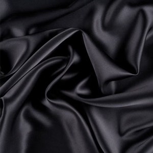 May include: A smooth, black satin fabric with a luxurious drape. The fabric is soft and silky to the touch.