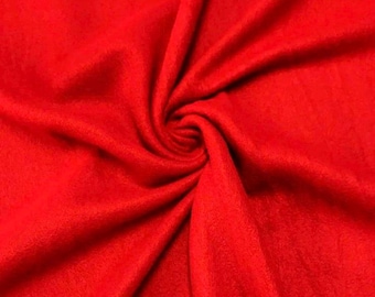Peut inclure: Un gros plan sur un tissu en polaire rouge vif. Le tissu est doux et a une texture légèrement duveteuse.
