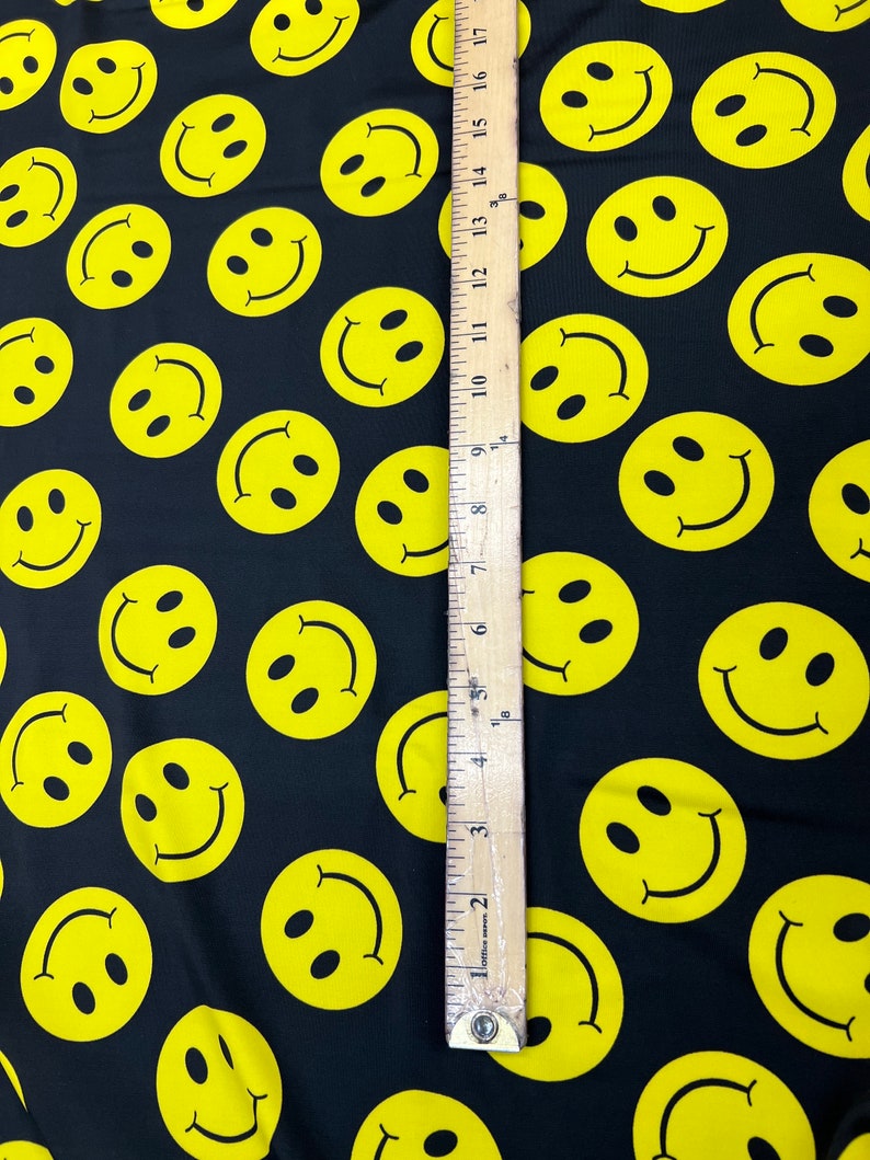 Yellow Happy Face Print on Black Four Way Stretch Nylon Spandex Fabric ...