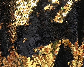 May include: Black fabric with gold sequins in a wave pattern.