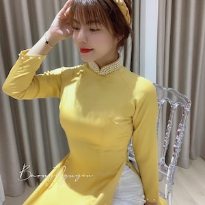 Mooie gele Ao Dai met kralen, Ao Dai voor bruidsmeisjes, bruidsmeisjes ao Dai, Ao Dai Viet Nam Phu Dau Ket Cuom, Áo dài phụ dâu kết cườm