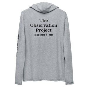 May include: A gray long-sleeve hooded sweatshirt with the text "The Observation Project Look Listen & Learn" on the back and the text "Look Listen Learn" repeated on each sleeve.