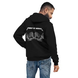 May include: Black hooded sweatshirt with a white graphic design on the back. The graphic features a stylized image of stacked books with the text "Atheist by Design" above it.