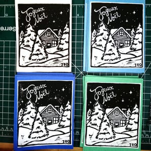 linocut print Christmas card - cozy winter cabin
