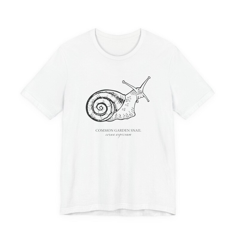 Black short sleeve tee shirt with a hand drawn white image of a garden snail with a detailed spiral shell and underneath the words common garden snail with the latin name beneath that.