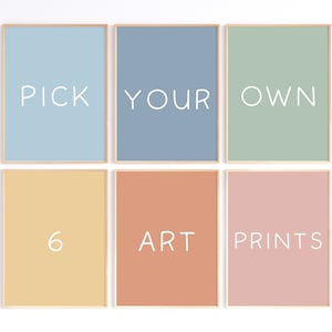 May include: Six framed art prints with pastel backgrounds in blue, green, peach, and pink. Each print has white text: "PICK YOUR OWN" and "6 ART PRINTS". The frames are a light wood color.