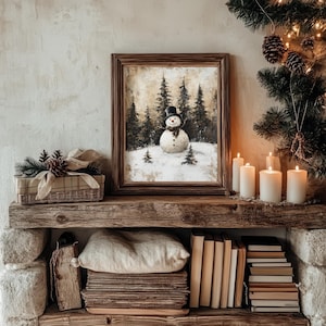 a muted print of a snowman in a winter landscape, framed in a cozy cottage living room