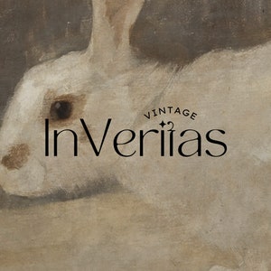 May include: A vintage illustration of a white rabbit with a black eye. The text "InVerias" is written in black lettering with the word "Vintage" above it.