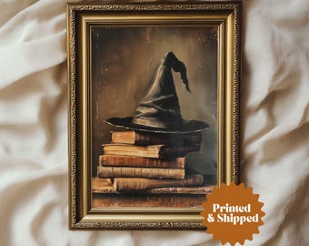 May include: A framed painting of a black witch's hat sitting on top of a stack of old books. The hat is made of felt and has a wide brim. The books are bound in leather and have gold lettering on the spines.