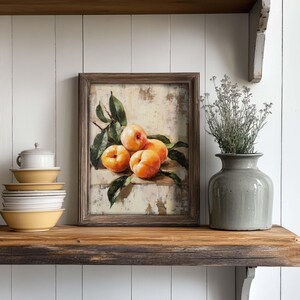 May include: A framed painting of a still life with four ripe peaches and green leaves on a textured background.