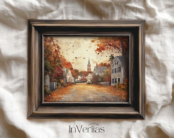 May include: A framed landscape painting depicting a quaint town scene in autumn. The artwork features a road lined with houses and trees with vibrant fall foliage. The frame is dark brown, and the painting has a vintage aesthetic. The text "Vintage InVeriias" is at the bottom.