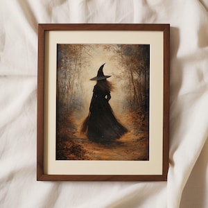 May include: A framed painting of a witch walking through a forest. The witch is wearing a black dress and a pointed hat. The forest is filled with trees and leaves in shades of brown and gold.