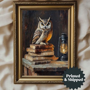 May include: Framed painting of a detailed owl perched atop a stack of books. The owl has brown and white feathers and yellow eyes. A lit lantern sits beside the books. The painting is in a gold frame.